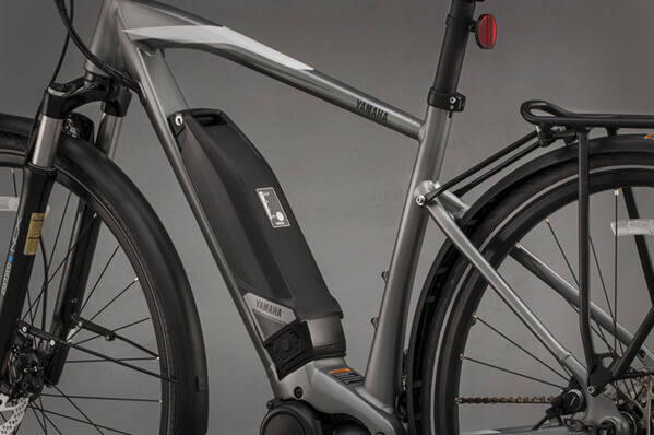 Side view of bicycle with close up of battery compartment